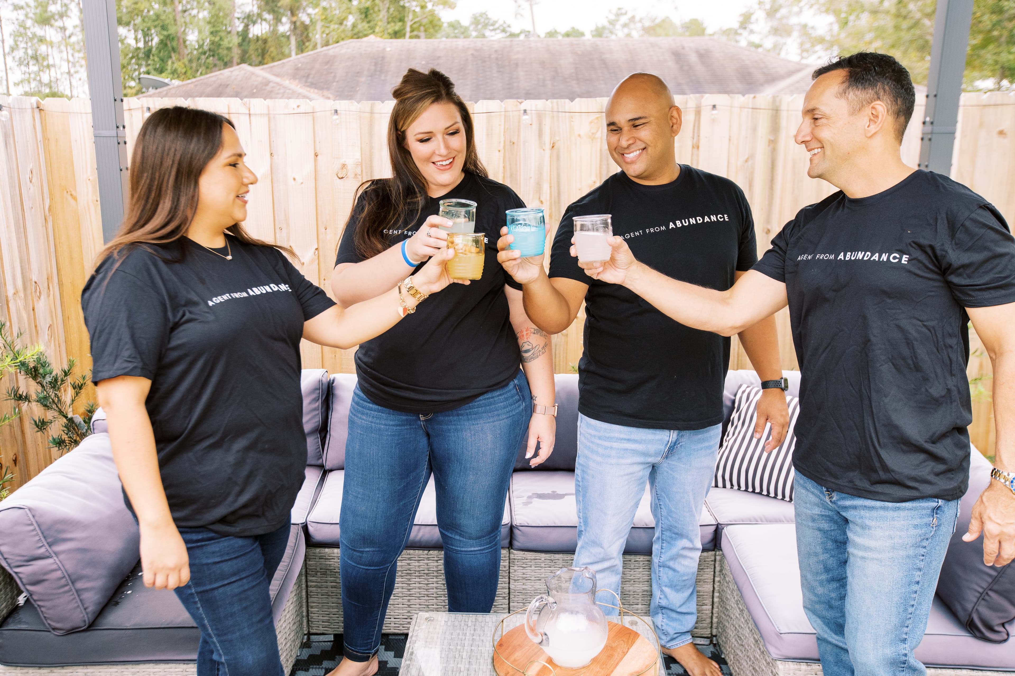 Four people making a cheers